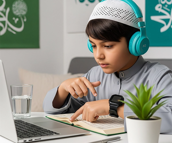A young boy in a prayer cap and headphones, pointing to the Quran while learning Tajweed Course Online, showing focused and interactive learning.